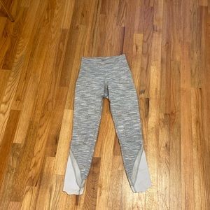 Lululemon grey leggings with a scallop and mesh detailing